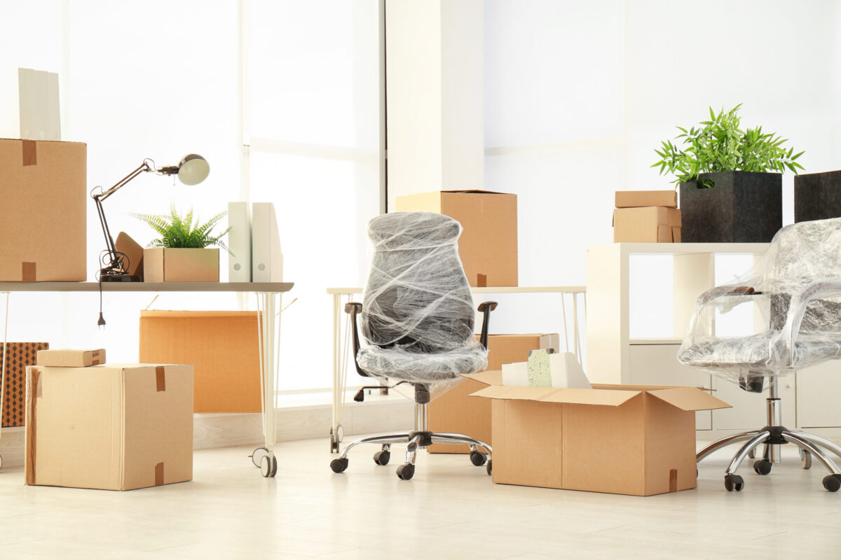 Modern Business Interiors st Louis office furniture and design services and warehousing Professional decorator choosing the best upholstery for the armchair