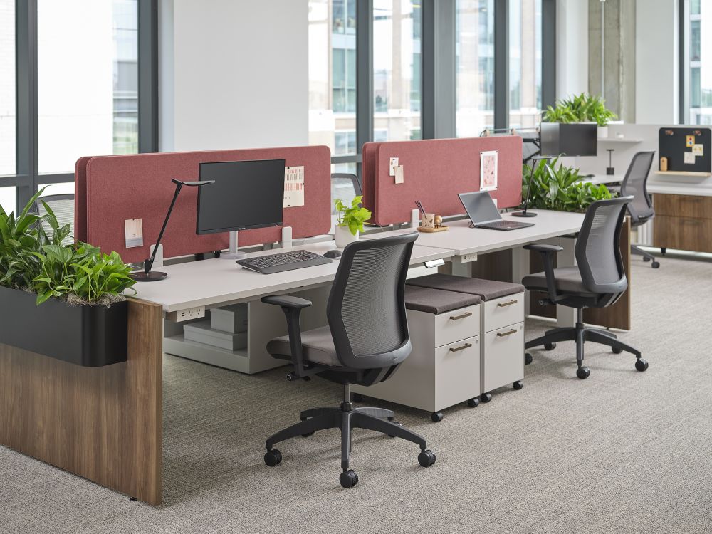 Allsteel Fulton Market showroom workstations with red privacy panels and plants in Chicago, IL
