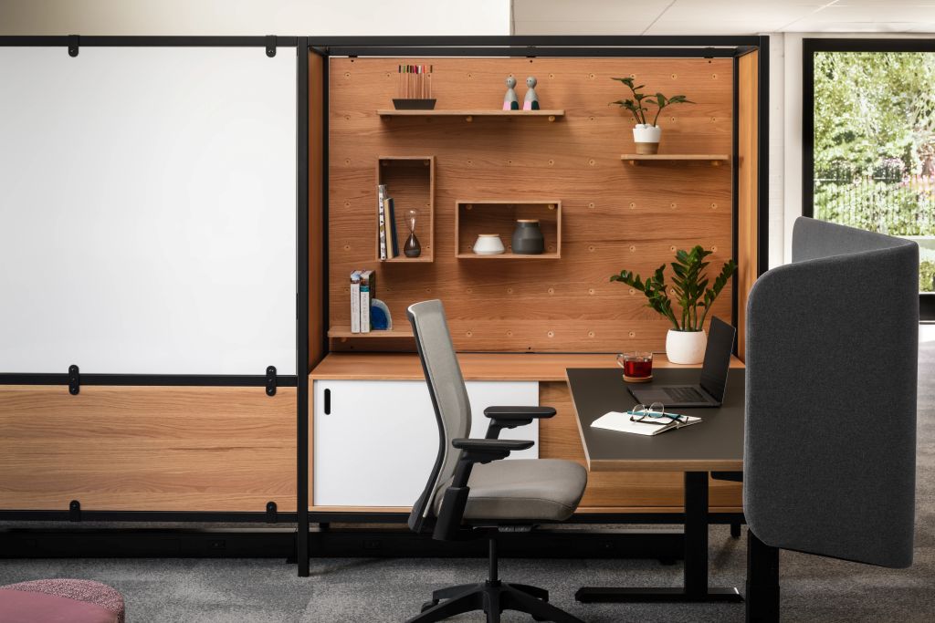 Private office with warm wood wall storage, floating shelves, and desk seating in San Francisco, CA