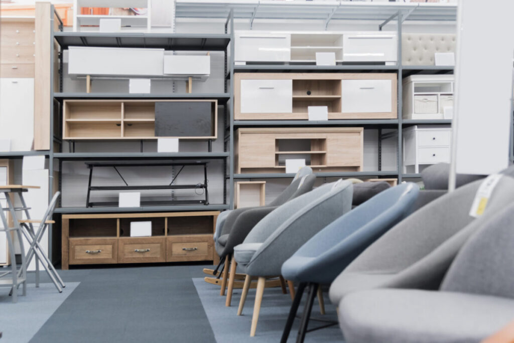 Modern Business Interiors office furniture display with shelving, cabinets, and finish samples