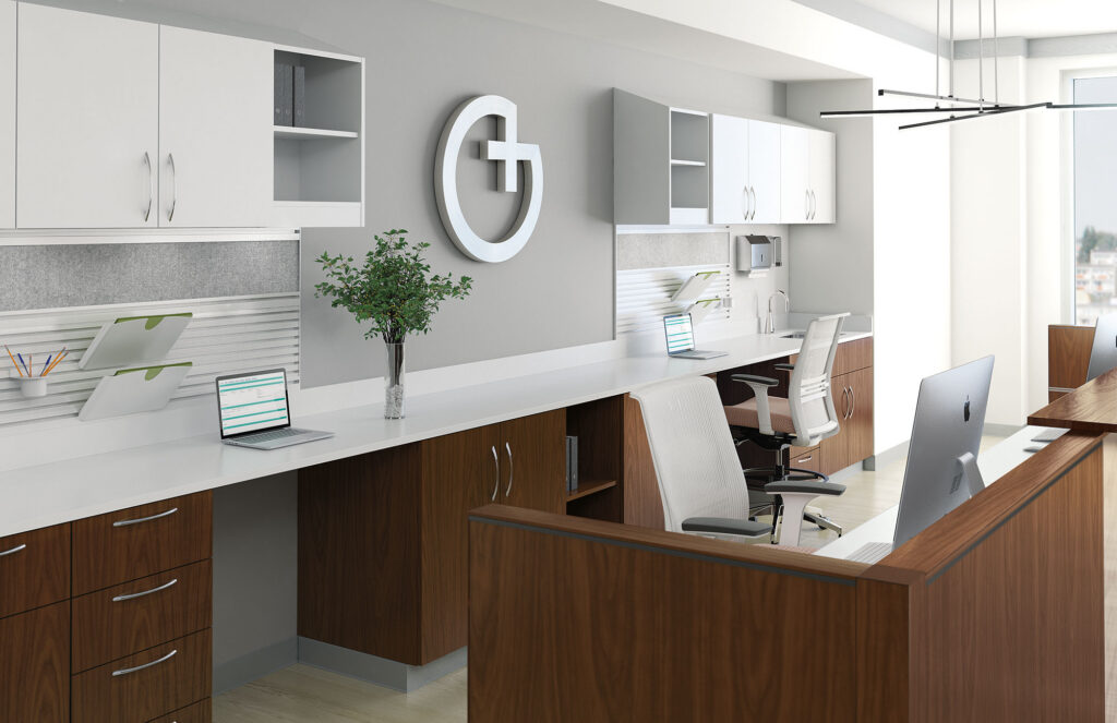 Healthcare reception station with white cabinetry, work surfaces, storage, and biophilic wall accents