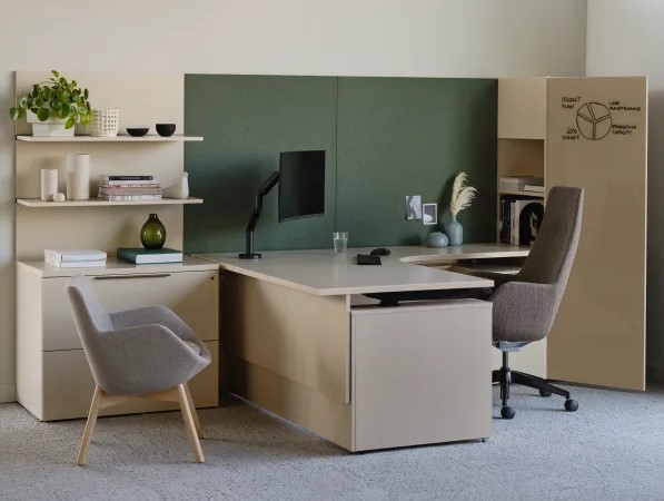 Modern private office with an L-shaped workstation, ergonomic chair, guest chair, shelving, and built-in storage.