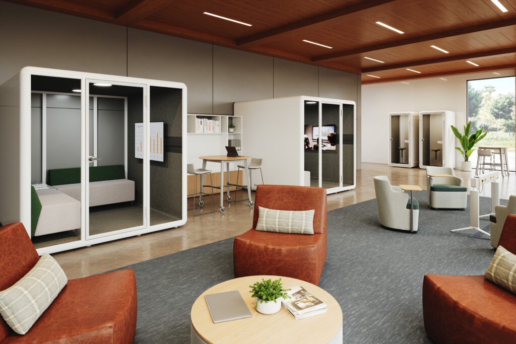 Modern office lounge with upholstered seating, acoustic privacy pods, collaboration tables, and integrated video displays.