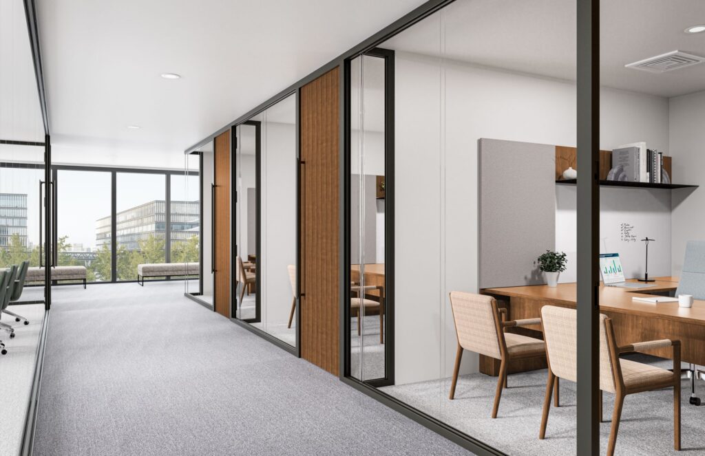 Modern office corridor with glass-fronted private meeting rooms, wood doors, collaborative seating, and floor-to-ceiling city-view windows.